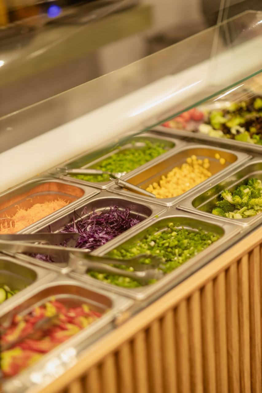 Fresh ingredients on the Poke Bar line